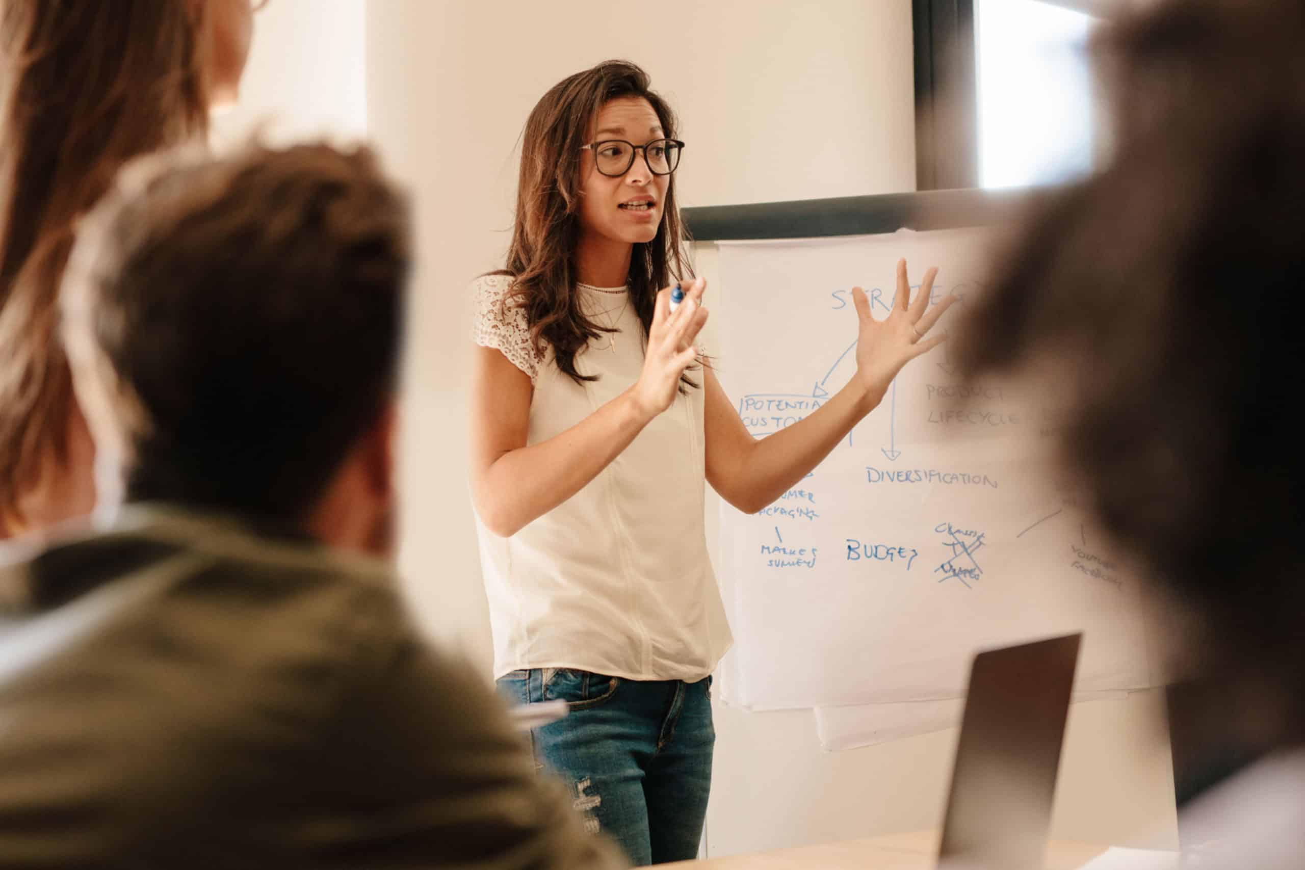 Woman at whiteboard