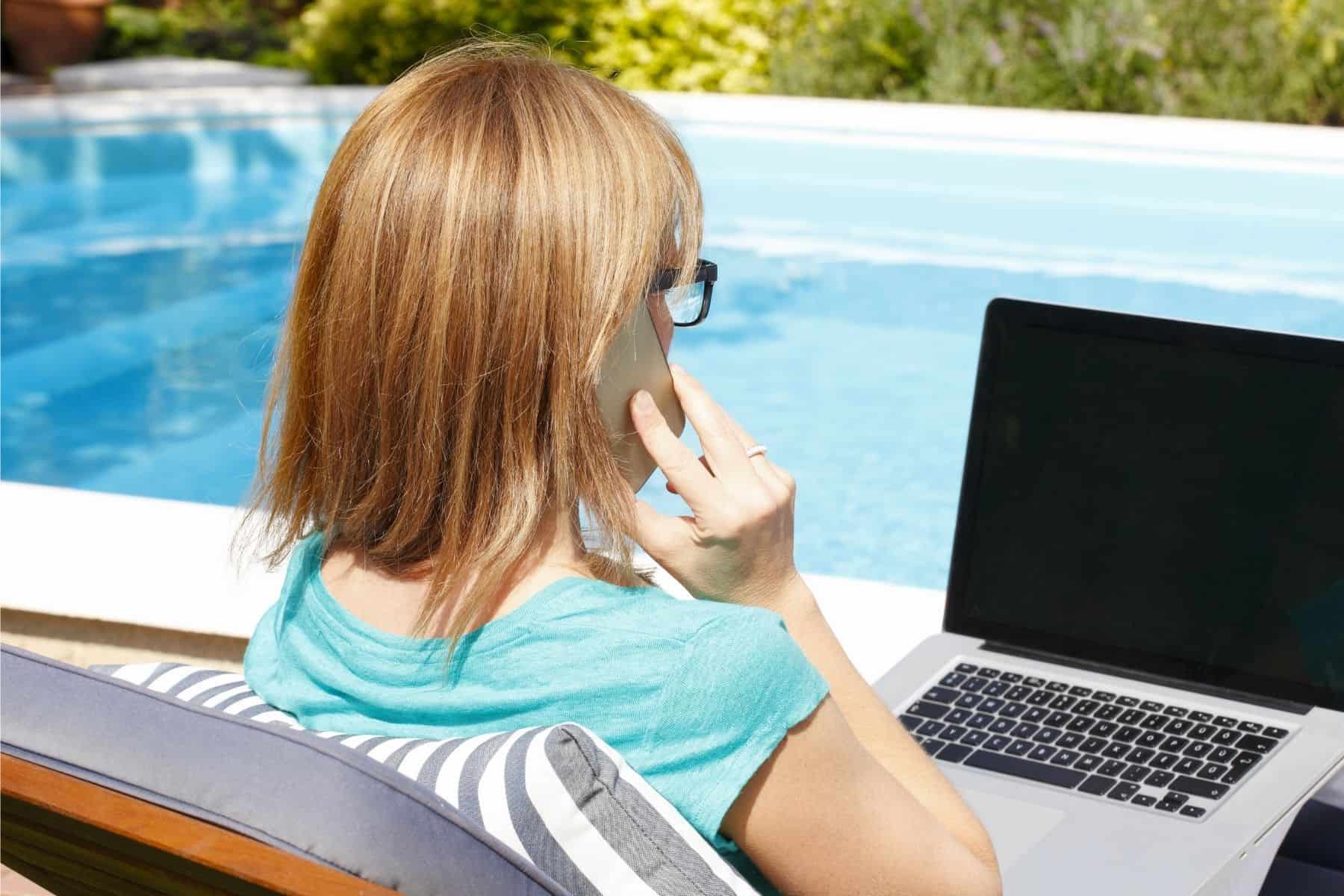 Lady on phone by pool