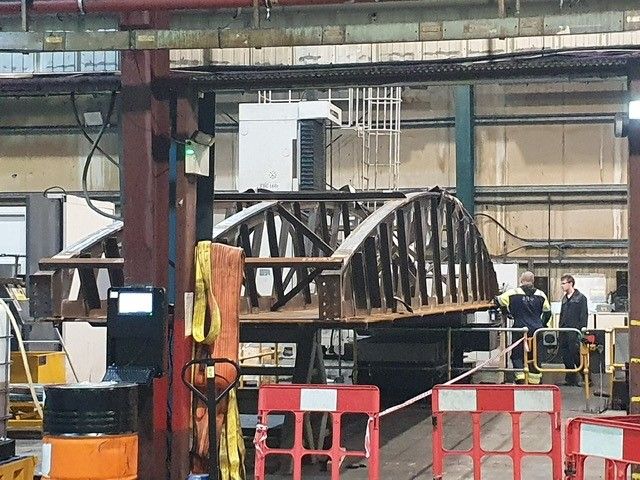 A bridge being built in a factory